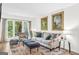 Bright living room featuring a large window offering natural light, a comfortable sofa and stylish decor at 2694 Greentree Se Dr, Marietta, GA 30067