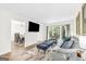 Spacious living room showcasing an open layout connecting to the dining area with views of the outdoors at 2694 Greentree Se Dr, Marietta, GA 30067