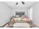 Well-lit main bedroom features a large upholstered headboard, ceiling fan and plush decor at 2694 Greentree Se Dr, Marietta, GA 30067