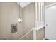 View of a carpeted staircase with white painted spindles leading to the upper level at 2694 Greentree Se Dr, Marietta, GA 30067