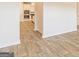 This hallway features wood-look floors, neutral paint and access to the kitchen at 506 Alford Cv # 89, Fairburn, GA 30213