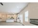 Open-concept living space with modern fireplace, abundant natural light, and seamless access to the kitchen, perfect for entertaining at 506 Alford Cv # 89, Fairburn, GA 30213