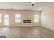Spacious living area features modern fireplace, large windows, and seamless flooring, perfect for Gathering gatherings and relaxation at 506 Alford Cv # 89, Fairburn, GA 30213