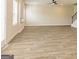 Expansive living area with stylish flooring, large windows, and neutral walls, creating a bright and inviting atmosphere at 506 Alford Cv # 89, Fairburn, GA 30213