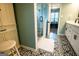 Charming bathroom with black and white patterned floors, and modern shower with glass doors at 1612 Cagle Ct, Lawrenceville, GA 30045
