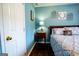 Bedroom featuring a dark hardwood floor, blue walls, and a nightstand with a lamp at 1612 Cagle Ct, Lawrenceville, GA 30045