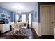 Stylish dining area with hardwood floors, updated light fixture, and bright window at 1612 Cagle Ct, Lawrenceville, GA 30045