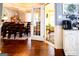 Dining room with hardwood floors, chandelier, and a doorway view of the sunroom at 1612 Cagle Ct, Lawrenceville, GA 30045