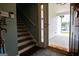 Entryway featuring stairs, a stained glass door, and an outdoor porch area at 1612 Cagle Ct, Lawrenceville, GA 30045