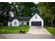 Charming one-story home features a black roof, two-car garage, and a well-manicured lawn at 1612 Cagle Ct, Lawrenceville, GA 30045