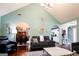 Open-concept living room with vaulted ceilings, archways, and a view of the dining area at 1612 Cagle Ct, Lawrenceville, GA 30045