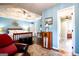 Main bedroom with a ceiling fan, hardwood floors, and a view of the bedroom hallway at 1612 Cagle Ct, Lawrenceville, GA 30045