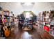 Office with hardwood floors, built-in bookshelves, and a desk with chairs at 1612 Cagle Ct, Lawrenceville, GA 30045
