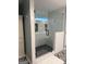 Stylish bathroom shower with frameless glass door, subway tile walls, and built-in niche for storage at 1612 Cagle Ct, Lawrenceville, GA 30045