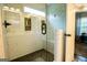 Glass shower with white subway tile, built in shelves, bench, and bronze shower hardware at 1612 Cagle Ct, Lawrenceville, GA 30045