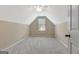 Clean, carpeted attic space, naturally illuminated, offering versatile use at 240 Turnbridge Cir, Peachtree City, GA 30269