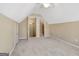 Versatile attic space with multiple doors, carpeted floors, offering flexible design options at 240 Turnbridge Cir, Peachtree City, GA 30269