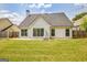 Picturesque backyard featuring a lush lawn, complemented by a porch swing for relaxation at 240 Turnbridge Cir, Peachtree City, GA 30269
