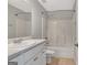 Clean bathroom with a shower-tub combo, vanity, and neutral tile flooring at 240 Turnbridge Cir, Peachtree City, GA 30269
