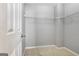 Walk-in closet features neutral carpet and wire shelving for storage at 240 Turnbridge Cir, Peachtree City, GA 30269