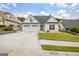 Charming home with a well-manicured lawn, three-car garage, and inviting curb appeal at 240 Turnbridge Cir, Peachtree City, GA 30269
