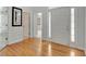 Elegant foyer with hardwood floors and natural light streaming through the front door at 240 Turnbridge Cir, Peachtree City, GA 30269