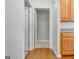 Hallway showing access to other rooms in the house and light wood cabinets at 240 Turnbridge Cir, Peachtree City, GA 30269