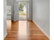 Welcoming foyer with hardwood floors, offering a view of the home's bright and open layout at 240 Turnbridge Cir, Peachtree City, GA 30269
