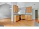 A kitchen with light wood cabinets, stainless steel appliances, and hardwood flooring at 240 Turnbridge Cir, Peachtree City, GA 30269
