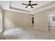 Spacious primary bedroom with carpet flooring and a ceiling fan at 240 Turnbridge Cir, Peachtree City, GA 30269