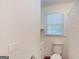 A clean bathroom with a window and toilet at 100 Willow Wood Road, Social Circle, GA 30025