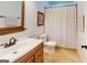 Bathroom with marble tile flooring, and a wood vanity at 100 Willow Wood Road, Social Circle, GA 30025