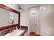 Bathroom featuring decorative mirror, vanity, open shelves, and closet at 100 Willow Wood Road, Social Circle, GA 30025