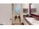 Bathroom includes neutral paint, custom tiling and bronze fixtures, with lots of storage at 100 Willow Wood Road, Social Circle, GA 30025