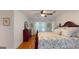 Bedroom featuring a ceiling fan, wood floors, and bright natural light at 100 Willow Wood Road, Social Circle, GA 30025