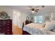Bright bedroom with ceiling fan, hardwood floors, and natural light at 100 Willow Wood Road, Social Circle, GA 30025