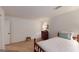 Bedroom features a single bed, paneled walls, a wooden dresser, and neutral carpet at 100 Willow Wood Road, Social Circle, GA 30025