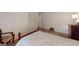 Bedroom featuring a bed, closet, and carpet, illuminated by a lamp at 100 Willow Wood Road, Social Circle, GA 30025
