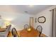 Cozy dining area with hardwood floors, table, and chairs near a bright window, perfect for meals at 100 Willow Wood Road, Social Circle, GA 30025