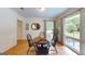 Charming dining room featuring a round table and sun-drenched windows overlooking the outdoors at 100 Willow Wood Road, Social Circle, GA 30025