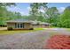 Charming ranch home featuring a well maintained front yard and a welcoming entrance at 100 Willow Wood Road, Social Circle, GA 30025