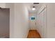 Hallway with white walls and hardwood floors at 100 Willow Wood Road, Social Circle, GA 30025