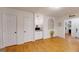 Kitchen offers white brick, wood floors, and storage with a small window feature at 100 Willow Wood Road, Social Circle, GA 30025