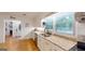 Kitchen features granite counters, a stainless sink and modern appliances at 100 Willow Wood Road, Social Circle, GA 30025