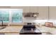 Close up of stainless range and granite counters at 100 Willow Wood Road, Social Circle, GA 30025