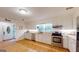 Updated kitchen with stainless appliances, white cabinets and hardwood flooring at 100 Willow Wood Road, Social Circle, GA 30025