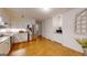 Bright kitchen features stainless steel appliances, granite countertops, and ample cabinet space at 100 Willow Wood Road, Social Circle, GA 30025