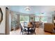 Open living and dining area features hardwood floors and bright natural light at 100 Willow Wood Road, Social Circle, GA 30025