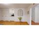 Cozy living room featuring a decorative brick wall and hardwood floors at 100 Willow Wood Road, Social Circle, GA 30025