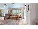 Comfortable living room featuring plush seating, natural light, and a serene ambiance at 100 Willow Wood Road, Social Circle, GA 30025